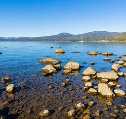 Sailboat Floating The Clear Water of Lake Tahoe at  Kings Beach, Kings Beach State Recreation Area,...