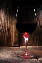glass of wine on wooden table