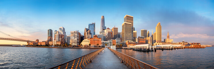 the skyline of san francisco during sunrise seen from pier 14