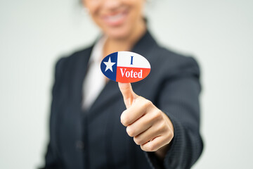 Professional Smiling Woman In Suit Holding Up On Finger 