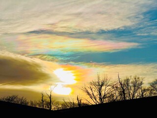 Rare fire iridescent clouds appearing overhead in the sky before sunset in the winter over Long...