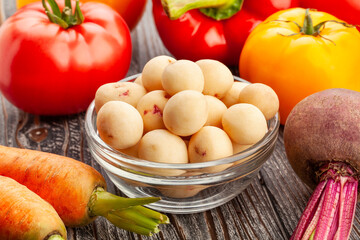 young potato bowl on wood background