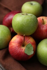Many fresh ripe apples on table, closeup