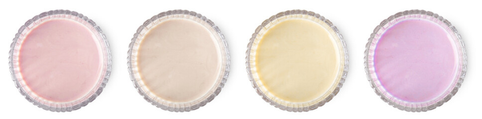 Protein shakes of different flavors in glasses isolated on white, top view