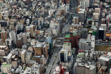 An overhead view of a traffic intersection in Tokyo.