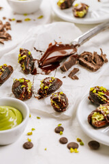 Preparing exquisite dessert, dates filled with pistachio mousse, alternative to popular Dubai chocolate bar
