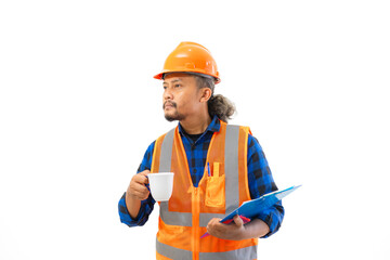 Fototapeta premium Indonesian male construction worker in full safety gear looking at report on clipboard while enjoying cup of coffee, construction and industry work concept, isolated on white background.