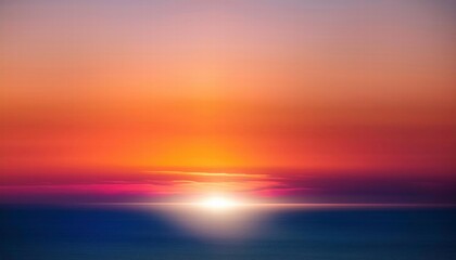 Obraz premium Serene Sunset Horizon: A breathtaking panorama of a vibrant sunset, capturing the celestial spectacle as the sun dips below the horizon, leaving behind a trail of fiery hues. The soft.