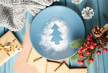 Christmas composition on a wooden background with luminous garlands.