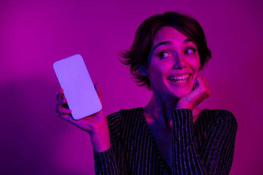 Photo portrait of pretty young girl look dreamy white screen dressed stylish overall outfit isolated on neon light pink color background