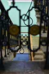 Beautiful railings with metal forged ornament on the staircase