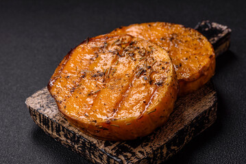 Pumpkin cut into slices and grilled with rosemary and spices
