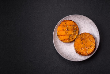 Pumpkin cut into slices and grilled with rosemary and spices