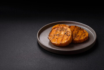 Pumpkin cut into slices and grilled with rosemary and spices