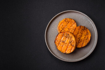 Pumpkin cut into slices and grilled with rosemary and spices
