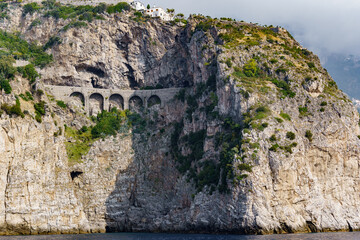 A beautiful old stone viaduct, built on the side of a steep rock