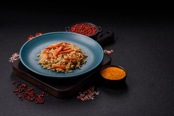 Delicious fresh pilaf with rice, carrots, meat, onions, spices and berries