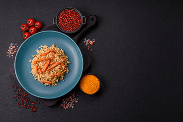 Delicious fresh pilaf with rice, carrots, meat, onions, spices and berries