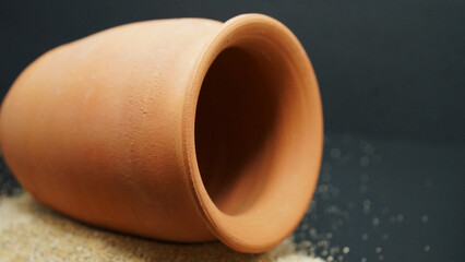 seashells Beautyful decoration with background of colorful small rocks, clay pot, class sand keepers and small magic portions 