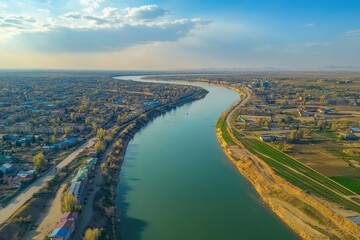 Fototapeta premium Aerial View of the Lower Ural River Flowing Through Saray Yuek in Atyrau, Kazakhstan - Central Asia Landscape
