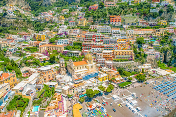 Positano town, beach and beautiful colorful houses on the cliff in Amalfi coast in Italy