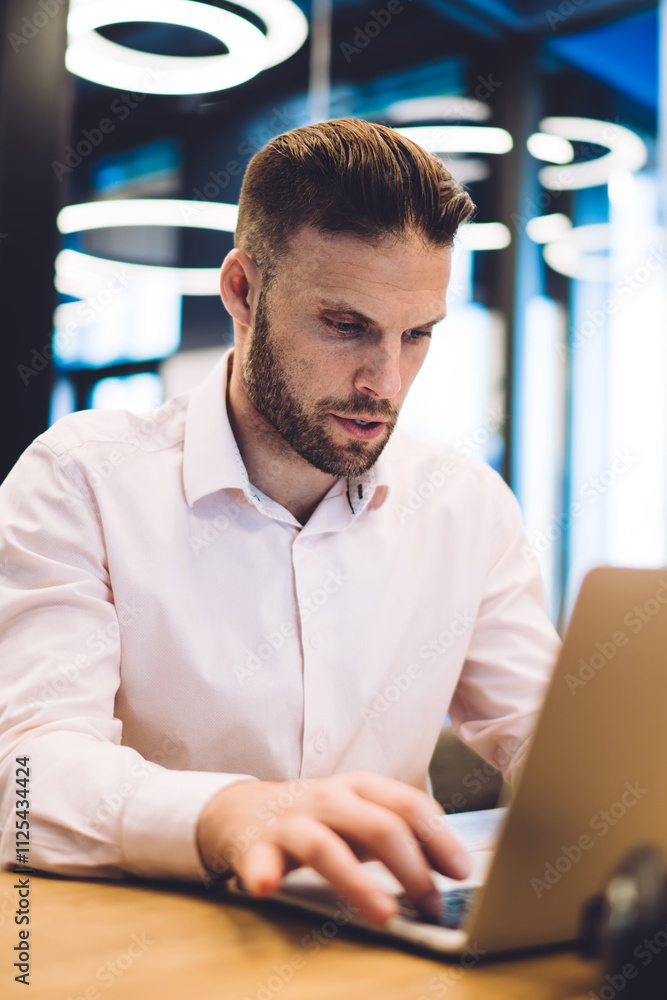 Poster smart casual male freelancer typing on laptop computer share publication in social networks, caucasi