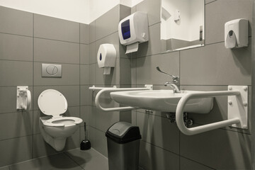 Public disabled toilet. Handrails for people with disabilities