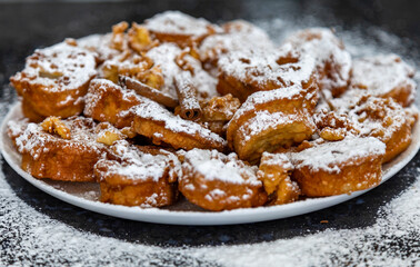 Authentic sweet Christmas French toast served with sugar and cinnamon in a Christmas atmosphere