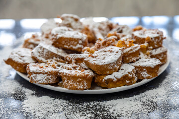 Authentic sweet Christmas French toast served with sugar and cinnamon in a Christmas atmosphere