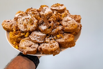 Authentic sweet Christmas French toast served with sugar and cinnamon in a Christmas atmosphere