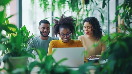 Young professionals collaborating in a bright, plant-filled office