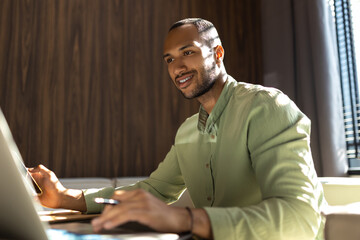 Businessman using laptop computer for working online