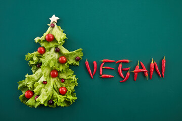 Fototapeta premium Vegan Christmas and Veganuary concept. Vegan Holiday Tree