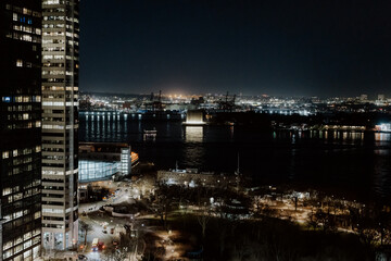 Fototapeta premium A stunning view of a nighttime urban skyline showcasing modern architecture