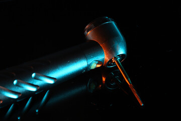 In dental treatments, a rotary dental handpiece used for tooth tissue cutting and cavity treatments in dental dentistry. © UniqDream