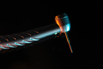 In dental treatments, a rotary dental handpiece used for tooth tissue cutting and cavity treatments in dental dentistry. © UniqDream