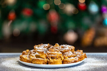 Authentic sweet Christmas French toast served with sugar and cinnamon in a Christmas atmosphere