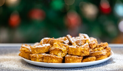 Authentic sweet Christmas French toast served with sugar and cinnamon in a Christmas atmosphere