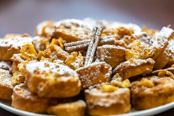 Authentic sweet Christmas French toast served with sugar and cinnamon in a Christmas atmosphere