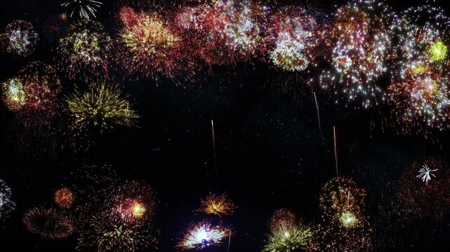 Colorful background with fireworks exploding over black background and space for your text. Holiday background.