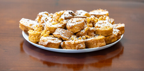 Authentic sweet Christmas French toast served with sugar and cinnamon in a Christmas atmosphere