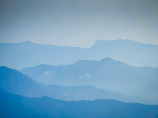 Obraz premium Vietnamese landscape with mountain scenery and shadows. Layers of mountains. Da Nang province, Vietnam. Aerial drone view