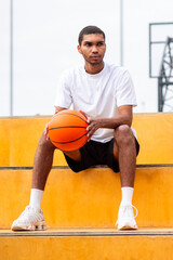 Naklejka premium Man in sportswear sitting after the game with an upset look