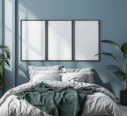 A minimalistic bedroom interior with three empty frames above a bed with white linens and a green blanket. next to a large green plant