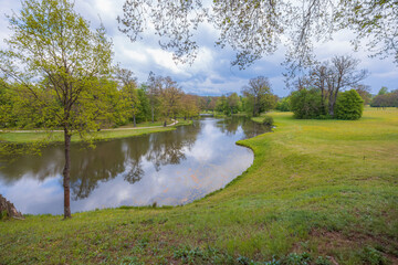 Serene Pond in Lush Spring Landscape