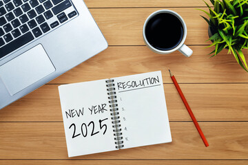 2025 Happy New Year Resolution Goal List and Plans Setting - Business office desk with notebook written about plan listing of new year goals and resolutions setting. Change and elation concept.