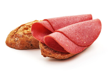 Smoked salami slices, isolated on white background.
