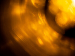 Abstract bokeh background with warm color. Digital background for design. Lens flare and light glow. Visual effect.