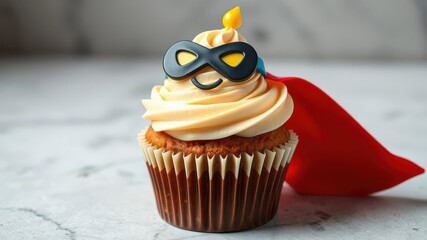 A festive birthday cupcake designed as a superhero with a colorful cape, mask, and lightning bolt symbol, colorful