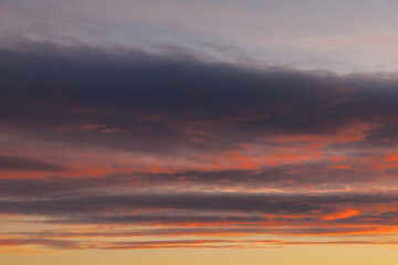 Golden sunset with hues of pink organge, blue and purple